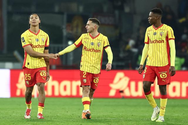 Lens' Burkinabe defender #25 Ismaelo Ganiou (L) celebrates with team mates after scoring his team's first goal during the French L1 football match between RC Lens and RC Strasbourg Alsace at the Stade Bollaert-Delelis in Lens, northern France, on November 22, 2025. (Photo by Sameer Al-DOUMY / AFP)