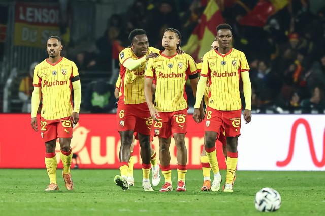 Lens' Burkinabe defender #37 Ismaelo Ganiou (3rd L) celebrates with team mates after scoring his team's first goal during the French L1 football match between RC Lens and RC Strasbourg Alsace at the Stade Bollaert-Delelis in Lens, northern France, on November 22, 2025. (Photo by Sameer Al-DOUMY / AFP)