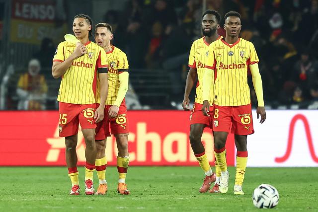 Lens' Burkinabe defender #25 Ismaelo Ganiou (L) celebrates with team mates after scoring his team's first goal during the French L1 football match between RC Lens and RC Strasbourg Alsace at the Stade Bollaert-Delelis in Lens, northern France, on November 22, 2025. (Photo by Sameer Al-DOUMY / AFP)