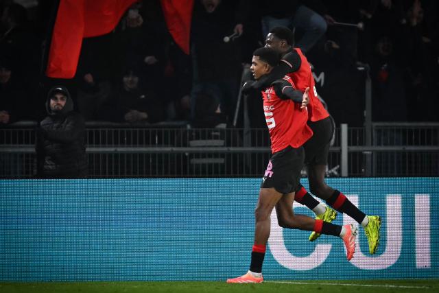 Rennes' Moroccan defender #48 Abdelhamid Ait Boudlal (L) celebrates  after scoring  the opening goal during the French L1 football match between Stade Rennais FC and AS Monaco at the Roazhon Park stadium in Rennes, western France, on November 22, 2025. (Photo by Lou BENOIST / AFP)