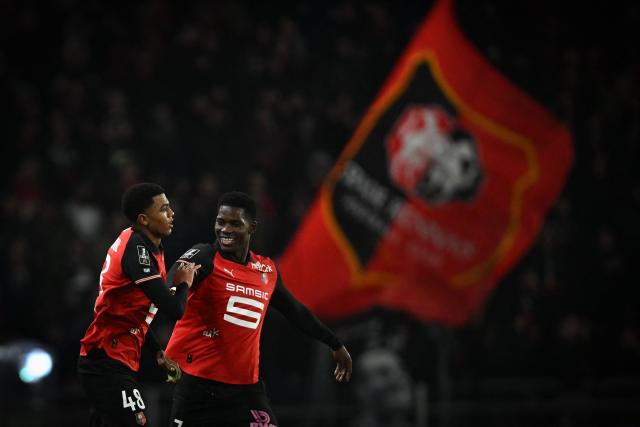 Rennes' Moroccan defender #48 Abdelhamid Ait Boudlal (L) celebrates after scoring the opening goal during the French L1 football match between Stade Rennais FC and AS Monaco at the Roazhon Park stadium in Rennes, western France, on November 22, 2025. (Photo by Lou BENOIST / AFP)