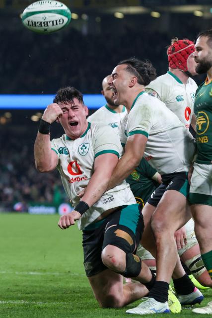 Ireland's hooker Dan Sheehan (L) celebrates scoring their first try during the Autumn Nations Series international rugby union match between Ireland and South Africa at the Aviva Stadium in Dublin, on November 22, 2025. (Photo by Paul Faith / AFP)