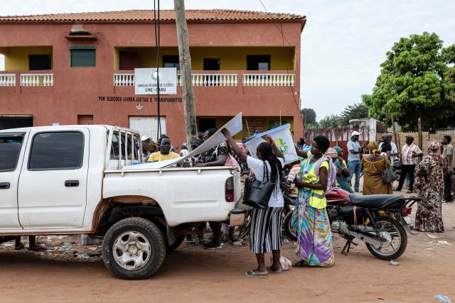 Officials from the National Electoral Commission (CNE) load electoral materials on the back of a pickup truck at their regional offices in Gabu, on November 22, 2025, on the eve of Guinea-Bissau’s general elections. Guinea-Bissau votes in general elections on November 23, 2025. (Photo by PATRICK MEINHARDT / AFP)
