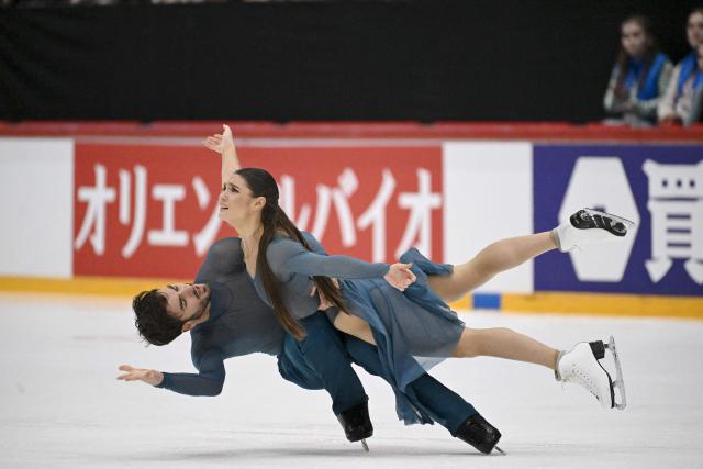 France's Laurence Fournier Beaudry and Guillaume Cizeron perform in the Ice Dance Free Dance competition during the ISU Grand Prix of Figure Skating Finlandia Trophy in Helsinki, Finland on November 22, 2025. (Photo by Mikko Stig / Lehtikuva / AFP) / Finland OUT