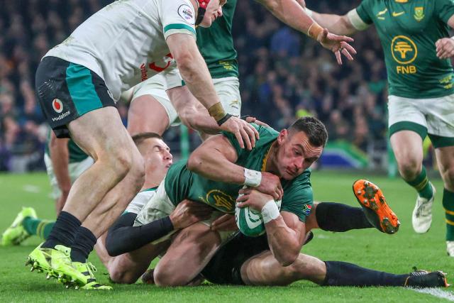 South Africa's centre Jesse Kriel is tackled during the Autumn Nations Series international rugby union match between Ireland and South Africa at the Aviva Stadium in Dublin, on November 22, 2025. (Photo by Paul Faith / AFP)