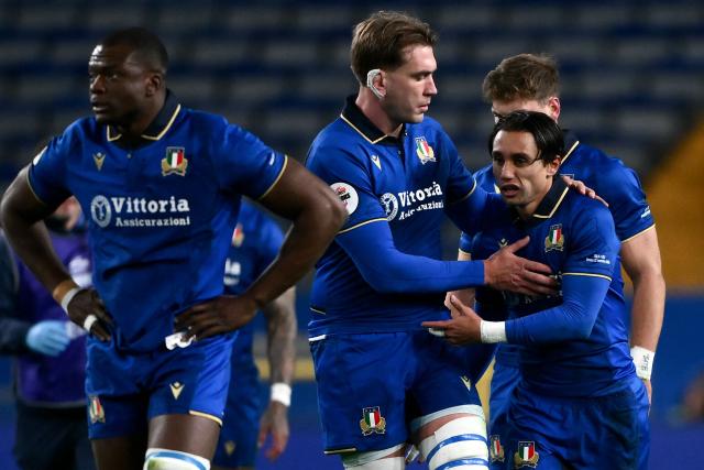 Italy's fullback Ange Capuozzo (R) celebrates with Italy's lock Federico Ruzza (C) after scoring a try during the Autumn Nations Series international rugby union test match between Italy and Chile at Stadio Luigi Ferraris stadium in Genoa, on November 22, 2025. (Photo by MARCO BERTORELLO / AFP)