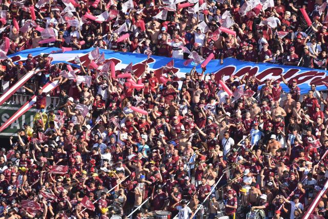 Lanus fans cheer for their team ahead of the Copa Sudamericana final football match between Argentina's Lanus and Brazil's Atletico Mineiro at the Defensores del Chaco stadium in Asuncion on November 22, 2025. (Photo by JOSE BOGADO / AFP)