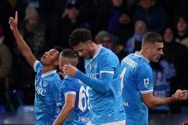 Napoli's Braziian forward #7 David Neres (L) celebrates with teammates after scoring his team's third goal during the Italian Serie A football match between SSC Napoli and Atalanta BC at the Diego Armando Maradona Stadium in Naples, on November 22, 2025. (Photo by CARLO HERMANN / AFP)