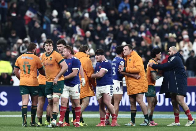 France's and Australia's players react after France won the Autumn Nations Series international rugby union test match between France and Australia at the Stade de France in Saint-Denis, north of Paris, on November 22, 2025. (Photo by Thibaud MORITZ / AFP)