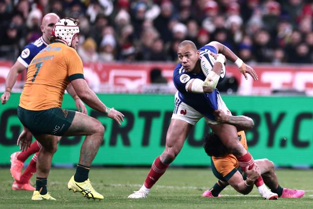France's centre #12 Gael Fickou is tackled  during the Autumn Nations Series international rugby union test match between France and Australia at the Stade de France in Saint-Denis, north of Paris, on November 22, 2025. (Photo by Thibaud MORITZ / AFP)