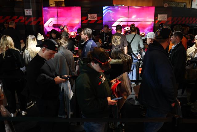Fans wait in line to buy merchandise at the F1 Hub at the Venetian before the start of the the Las Vegas Formula One Grand Prix in Las Vegas, Nevada, on November 22, 2025. (Photo by Patrick T. Fallon / AFP)