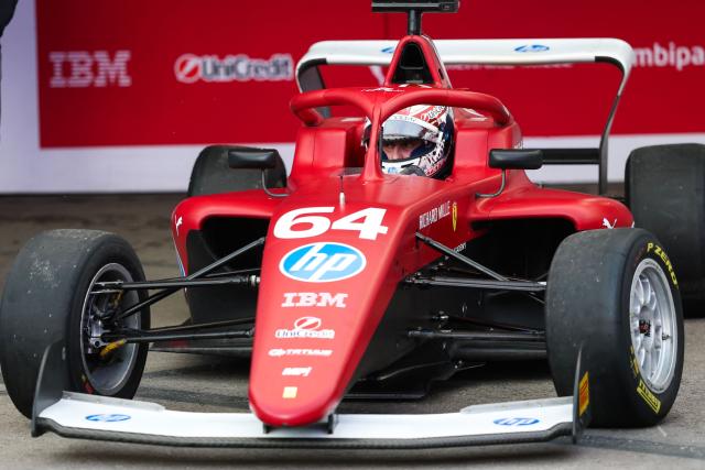 Dutch-Belgian driver Maya Weug pulls out of her garage before the start of the F1 Academy race at the Las Vega Strip Circuit in Las Vegas, Nevada, on November 22, 2025. (Photo by Patrick T. Fallon / AFP)