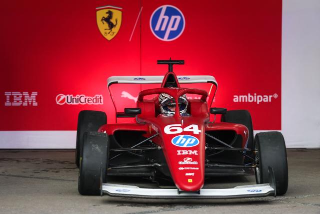 Dutch-Belgian driver Maya Weug pulls out of her garage before the start of the F1 Academy race at the Las Vega Strip Circuit in Las Vegas, Nevada, on November 22, 2025. (Photo by Patrick T. Fallon / AFP)