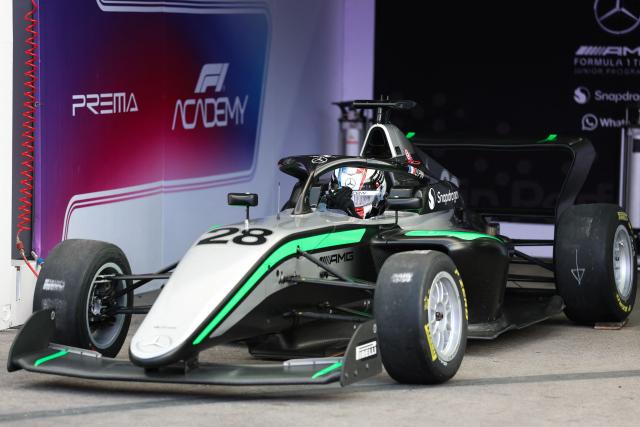 French driver Doriane Pin pulls out of her garage before the start of the F1 Academy race at the Las Vega Strip Circuit in Las Vegas, Nevada, on November 22, 2025. (Photo by Patrick T. Fallon / AFP)
