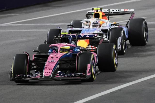 (L/R) Alpine's Argentinian driver Franco Colapinto races ahead of RB's New Zealander driver Liam Lawson during the Las Vegas Formula One Grand Prix at the Las Vegas Strip Circuit in Las Vegas, Nevada, on November 22, 2025. (Photo by Patrick T. Fallon / AFP)