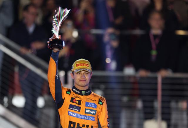 Second place finisher McLaren's British driver Lando Norris holds his trophy on the podium after the Las Vegas Formula One Grand Prix at the Las Vegas Strip Circuit in Las Vegas, Nevada, on November 22, 2025. Formula One world champion Max Verstappen produced a masterful drive to win the Las Vegas Grand Prix on Saturday as McLaren's Lando Norris finished second to edge closer to a maiden drivers' title.
Red Bull ace Verstappen pounced on a slip by pole-sitter Norris on the first turn of Sin City's street circuit to grab the lead and controlled the race thereafter to claim the 69th Grand Prix win of his career, finishing more than 20 seconds clear. (Photo by Patrick T. Fallon / AFP)