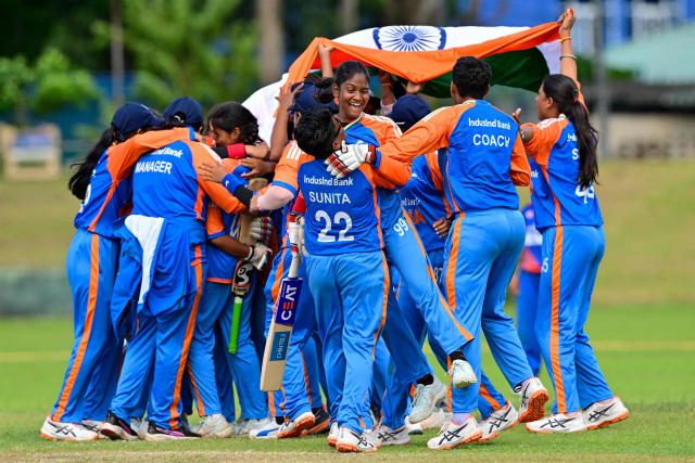 India's players celebrate after their team's victory in the first Blind Women's Twenty20 World Cup 2025 final match between India and Nepal at the P Sara Oval International Cricket Stadium in Colombo on November 23, 2025. (Photo by Ishara S. KODIKARA / AFP)