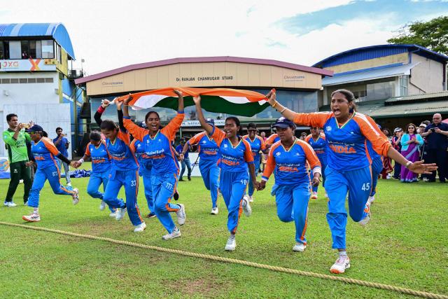 India's players celebrate after their team's victory in the first Blind Women's Twenty20 World Cup 2025 final match between India and Nepal at the P Sara Oval International Cricket Stadium in Colombo on November 23, 2025. (Photo by Ishara S. KODIKARA / AFP)