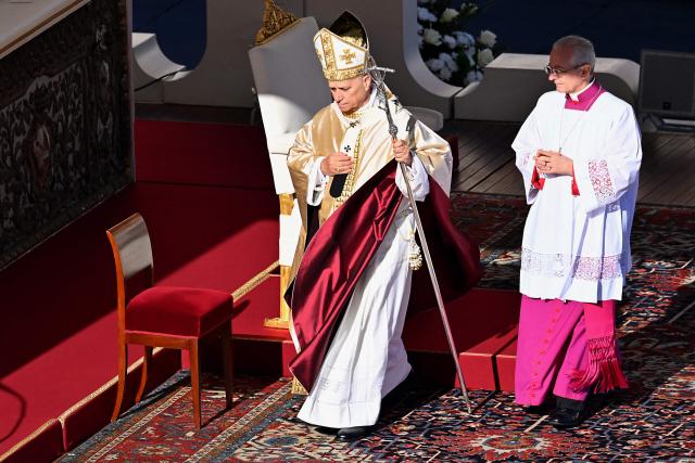 Pope Leo XIV (C) leaves at the end of the mass of Jubilee of Choirs and Choral Society at St Peter's Square in The Vatican on November 23, 2025. (Photo by Andreas SOLARO / AFP)