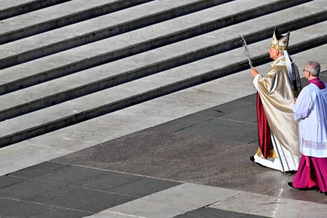Pope Leo XIV (L) leaves at the end of the mass of Jubilee of Choirs and Choral Society at St. Peter's Square in The Vatican on November 23, 2025. (Photo by Andreas SOLARO / AFP)