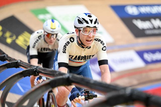 Belgium's Tom Crabbe (rear) and Britain's Mark Stewart (front) compete during the last day of the Zesdaagse Vlaanderen-Gent six-day indoor track cycling event at the indoor cycling arena 't Kuipke, in Gent, on November 23, 2025. (Photo by MAARTEN STRAETEMANS / Belga / AFP) / Belgium OUT