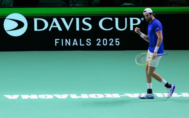 Italy's Matteo Berrettini reacts as he plays against Spain's Pablo Carreno Busta during their 2025 Davis Cup men's single final tennis match at the Super Tennis Arena in Bologna, northen Italy, on November 23, 2025. (Photo by Tiziana FABI / AFP)