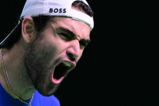 Italy's Matteo Berrettini reacts as he plays against Spain's Pablo Carreno Busta during their 2025 Davis Cup men's single final tennis match at the Super Tennis Arena in Bologna, northen Italy, on November 23, 2025. (Photo by Tiziana FABI / AFP)
