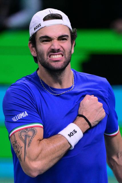 Italy's Matteo Berrettini celebrates after winning over Spain's Pablo Carreno Busta at the end of their 2025 Davis Cup men's single final tennis match at the Super Tennis Arena in Bologna, northen Italy, on November 23, 2025. (Photo by Tiziana FABI / AFP)