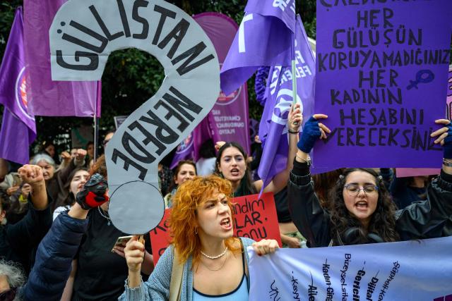 Protesters hold placards and shout slogans during a protest ahead of the International Day for the Elimination of Violence Against Women, in Istanbul, on November 23, 2025. (Photo by Yasin AKGUL / AFP)