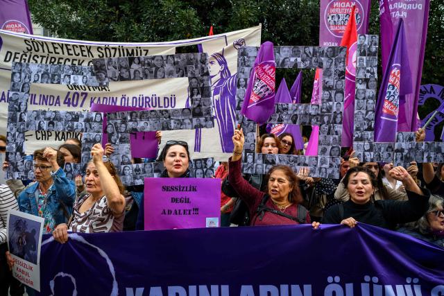 Protesters hold placards and shout slogans during a protest ahead of the International Day for the Elimination of Violence Against Women, in Istanbul, on November 23, 2025. (Photo by Yasin AKGUL / AFP)