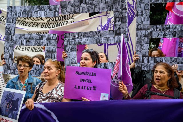 Protesters hold placards and shout slogans during a protest ahead of the International Day for the Elimination of Violence Against Women, in Istanbul, on November 23, 2025. (Photo by Yasin AKGUL / AFP)