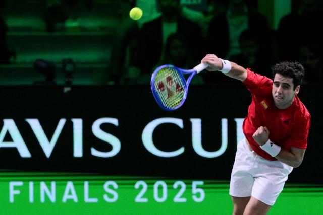 Spain's Jaume Munar Clar serves to Italy's Flavio Cobolli during their 2025 Davis Cup men's single final tennis match at the Super Tennis Arena in Bologna, northen Italy, on November 23, 2025. (Photo by Tiziana FABI / AFP)