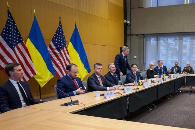 US Secretary of State Marco Rubio (5th L), US special envoy Steve Witkoff (4th L), US Secretary of the Army Daniel Driscoll (taking his seat) and US President Donald Trump's son-in-law Jared Kushner (L) face the Ukrainian delegation during discussions on a US plan to end the war in Ukraine at the US Mission in Geneva, on November 23, 2025. US Secretary of State Marco Rubio arrived in Geneva on November 23, 2025 morning for discussions on a US plan to end the Ukraine war, after Washington signalled room for negotiation on the controversial proposal. Ukrainian, European and Canadian officials were also gathering in the Swiss city. (Photo by Fabrice COFFRINI / AFP)