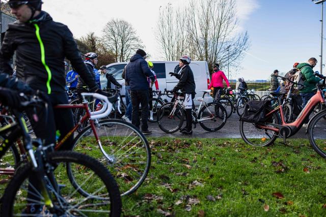 People take part in a commemorative cycling ride to pay tribute to Cindy Morvan, a 39-years-old ambassador for women's cycling who was shot dead by her ex-partner's girlfriend on October 31, 2025, in Calais, northern France, on November 11, 2025. (Photo by Sameer Al-DOUMY / AFP)