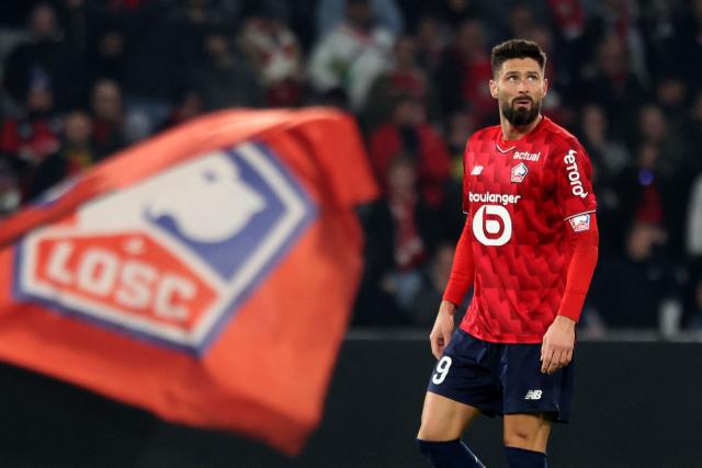 Lille's French forward #09 Olivier Giroud reacts after scoring a goal during the French L1 football match between Lille (LOSC) and Paris FC at the Stade Pierre-Mauroy in Villeneuve-d'Ascq, northern France, on November 23, 2025. (Photo by Francois LO PRESTI / AFP)