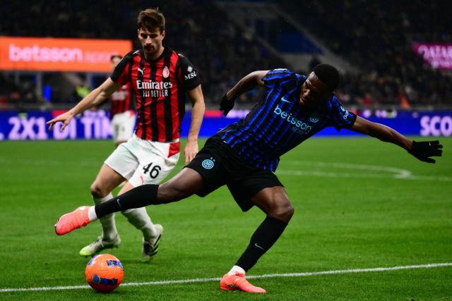 Inter Milan's French forward #14 Ange-Yoan Bonny controls the ball during the Italian Serie A football match between Inter Milan and AC Milan at San Siro stadium in Milan, northern Italy, on November 23, 2025. (Photo by Marco BERTORELLO / AFP)