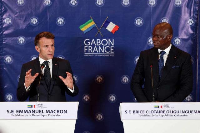 Gabon's President Brice Oligui Nguema (R) and France's President Emmanuel Macron (L) hold a joint press conference following their meeting in Libreville on November 23, 2025. (Photo by Ludovic MARIN / AFP)