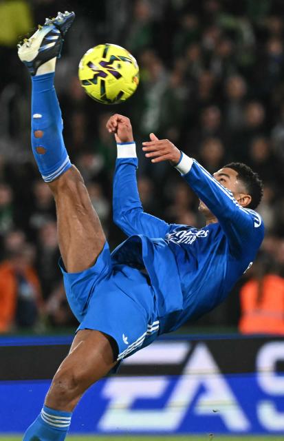 Real Madrid's English midfielder #05 Jude Bellingham kicks the ball during the Spanish league football match between Elche CF and Real Madrid CF at Martinez Valero Stadium in Elche on November 23, 2025. (Photo by JOSE JORDAN / AFP)
