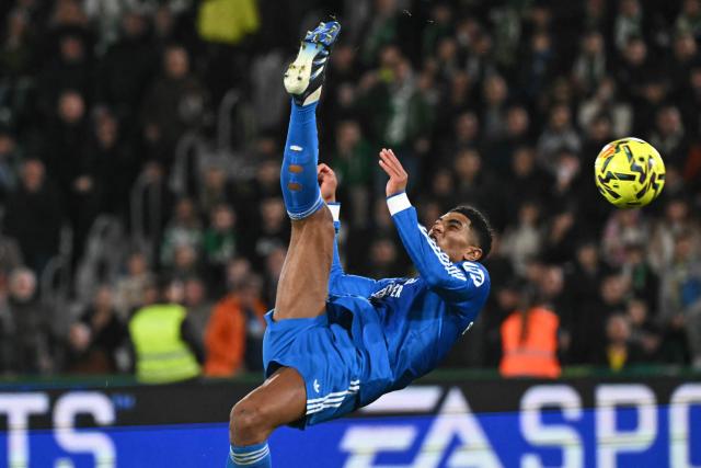 Real Madrid's English midfielder #05 Jude Bellingham kicks the ball during the Spanish league football match between Elche CF and Real Madrid CF at Martinez Valero Stadium in Elche on November 23, 2025. (Photo by JOSE JORDAN / AFP)