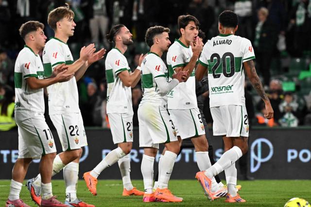 Elche players react at the end of the Spanish league football match between Elche CF and Real Madrid CF at Martinez Valero Stadium in Elche on November 23, 2025. (Photo by JOSE JORDAN / AFP)