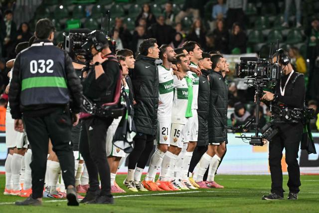 Elche players react at the end of the Spanish league football match between Elche CF and Real Madrid CF at Martinez Valero Stadium in Elche on November 23, 2025. (Photo by JOSE JORDAN / AFP)