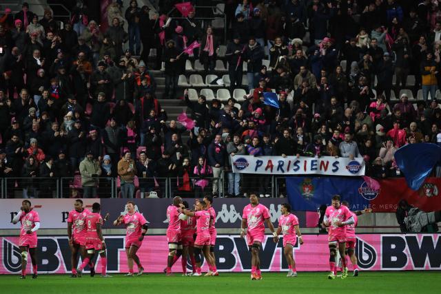 Stade Francais' players celebrate a try by Stade Français' French fly-half Louis Carbonel during the French Top14 rugby union match between Stade Francais Paris and RC Toulon at the Jean-Bouin Stadium in Paris on November 23, 2025. (Photo by Anne-Christine POUJOULAT / AFP)