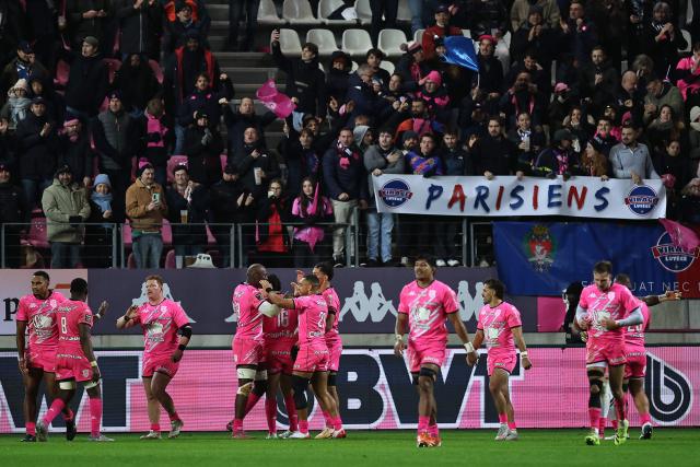 Stade Francais' players celebrate a try by Stade Français' French fly-half Louis Carbonel during the French Top14 rugby union match between Stade Francais Paris and RC Toulon at the Jean-Bouin Stadium in Paris on November 23, 2025. (Photo by Anne-Christine POUJOULAT / AFP)