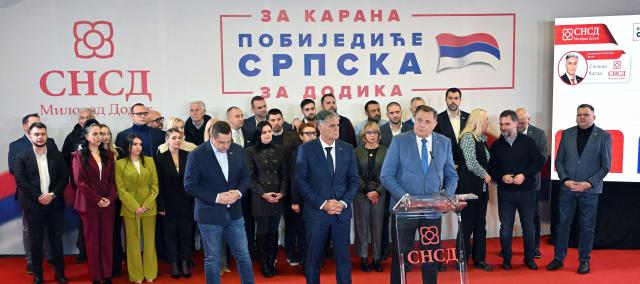Union of Independent Social Democrats (SNSD) party candidate Sinisa Karan (front C) listens to the speech of dismissed SNSD leader of the Bosnian Serb statelet Milorad Dodik (front R) announcing his victory in the election for a new Bosnian Serb president, at the nationalist party's headquarters in Banja Luka, on November 23, 2025. (Photo by ELVIS BARUKCIC / AFP)