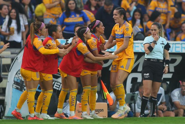 Tigres' forward #12 Diana Ordonez (R) celebrates with teammates after scoring  during the Liga MX Femenil Apertura final second leg football match between Tigres and America at the Universitario Stadium in Monterrey, Nuevo Leon state, Mexico on November 23, 2025. (Photo by Julio Cesar AGUILAR / AFP)