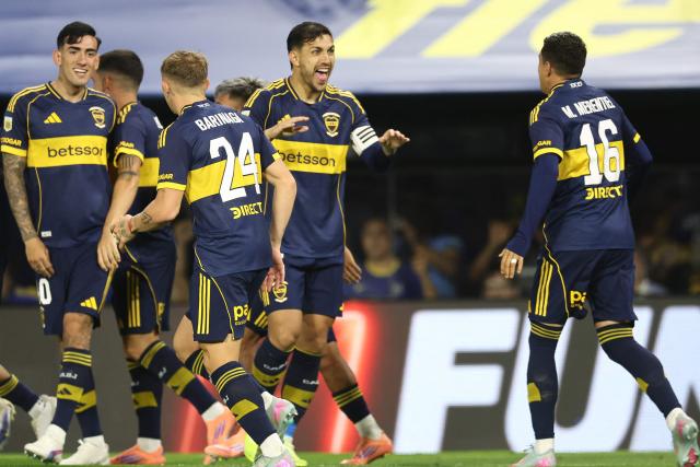 Boca Juniors' Uruguayan forward #16 Miguel Merentiel (R) celebrates scoring his team's second goal during the Argentine Professional Football League 2025 Clausura Tournament round of 16 match between Boca Juniors and Talleres de Cordoba at La Bombonera Stadium in Buenos Aires on November 23, 2025. (Photo by ALEJANDRO PAGNI / AFP)