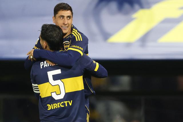 Boca Juniors’ Uruguayan forward #16 Miguel Merentiel (R) celebrates after scoring his team’s second goal with midfielder #5 Leandro Paredes during the Argentine Professional Football League 2025 Clausura Tournament round of 16 match between Boca Juniors and Talleres de Cordoba at La Bombonera Stadium in Buenos Aires on November 23, 2025. (Photo by ALEJANDRO PAGNI / AFP)