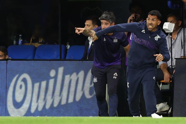Talleres' head coach Carlos Tevez reacts during the Argentine Professional Football League 2025 Clausura Tournament round of 16 match between Boca Juniors and Talleres de Cordoba at La Bombonera Stadium in Buenos Aires on November 23, 2025. (Photo by ALEJANDRO PAGNI / AFP)