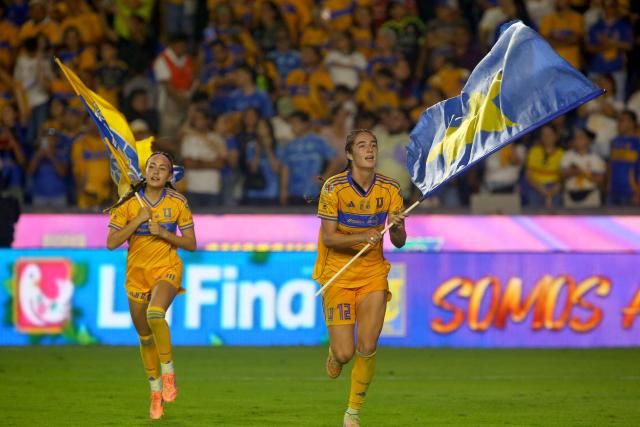 Tigres' forward #12 Diana Ordonez celebrates after winning the Liga MX Femenil Apertura final second leg football match between Tigres and America at the Universitario Stadium in Monterrey, Nuevo Leon state, Mexico on November 23, 2025. (Photo by Julio Cesar AGUILAR / AFP)