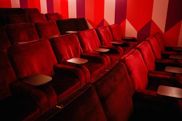 This photograph shows an interior view with movie theater seats of the Elysees Lincoln cinema in Paris on November 14, 2025. It was either reinvent themselves or close down. Faced with declining attendance, several independent Parisian cinemas have opted for innovation, opening new venues or expanding their activities, in an act of survival they describe as "militant". (Photo by Dimitar DILKOFF / AFP)